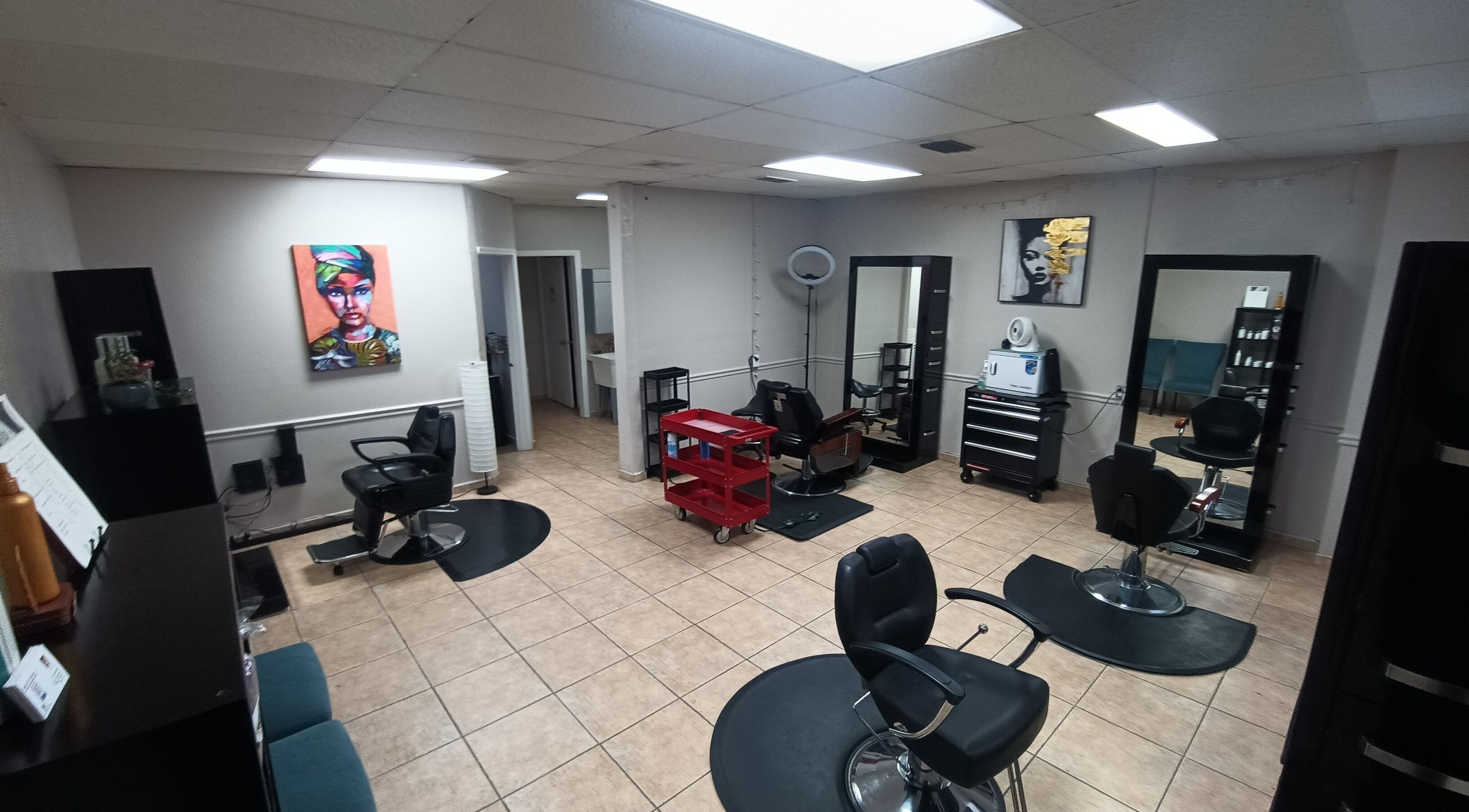 Interior of AJ Styles You Salon in Orlando, Florida, US featuring stylish chairs and mirrors.