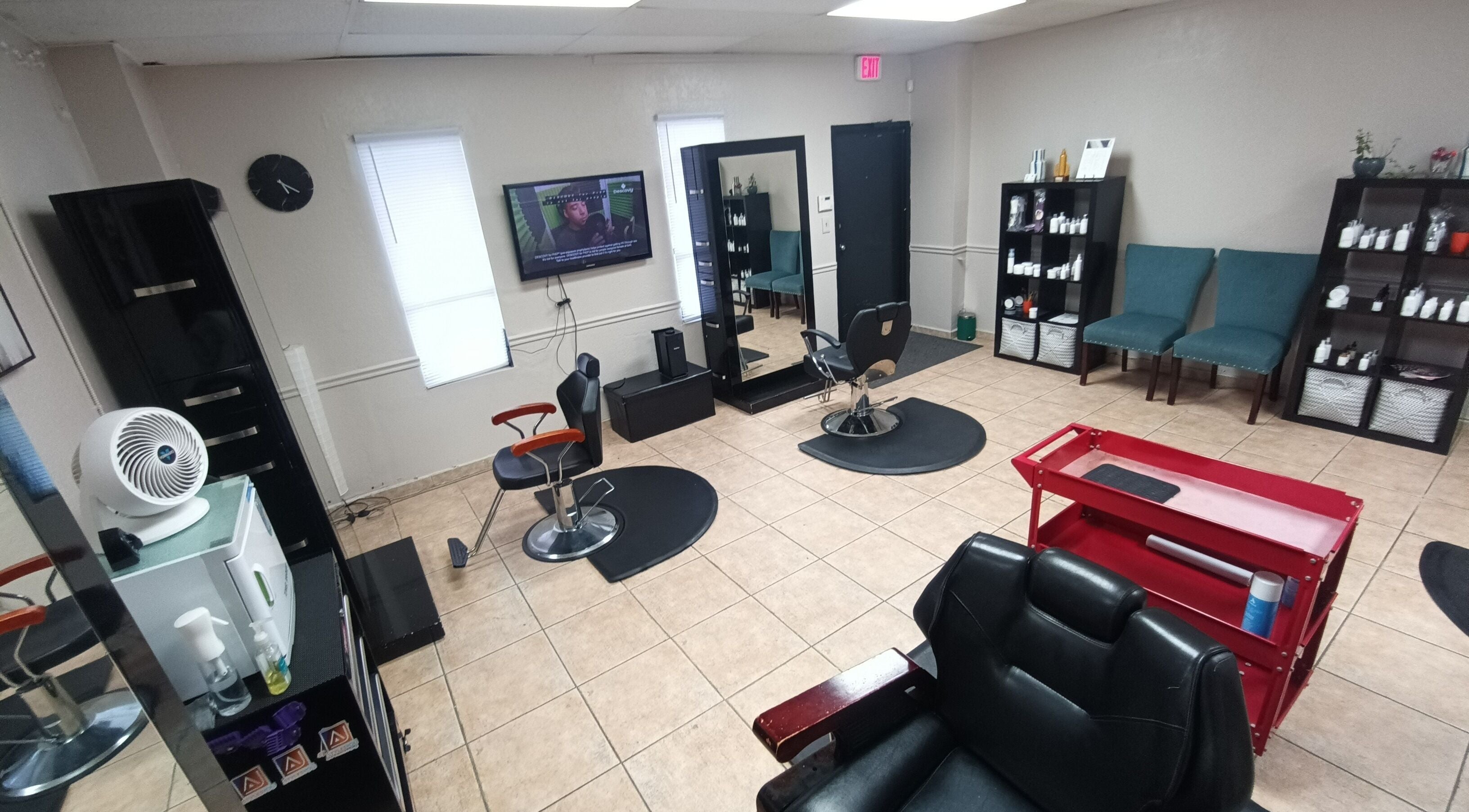 Interior of AJ Styles You Salon in Orlando, Florida, US, featuring styling chairs and modern decor.