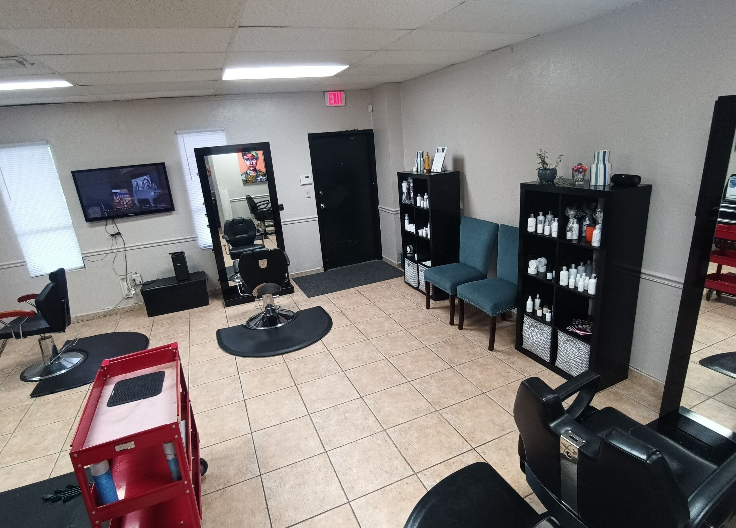Modern interior of AJ Styles You Salon in Orlando, Florida, US, showcasing salon chairs and shelves.