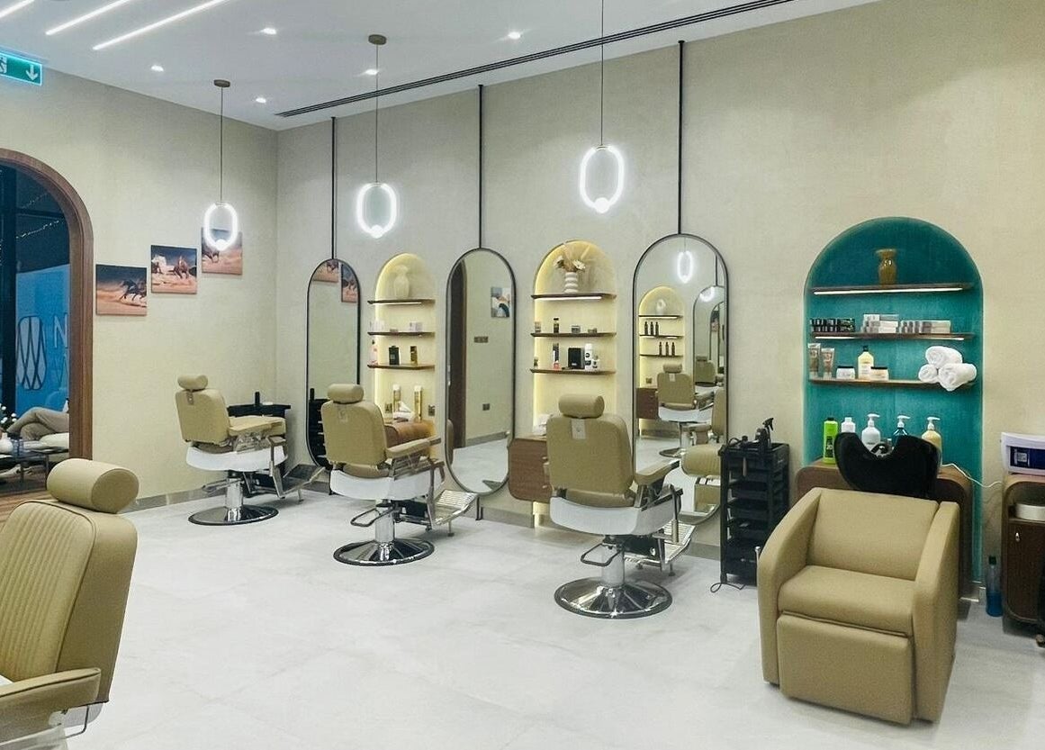 Modern interior of Zaks and Sons Salon and Spa, Manama, Capital Governorate, BH with stylish seating and mirrors.