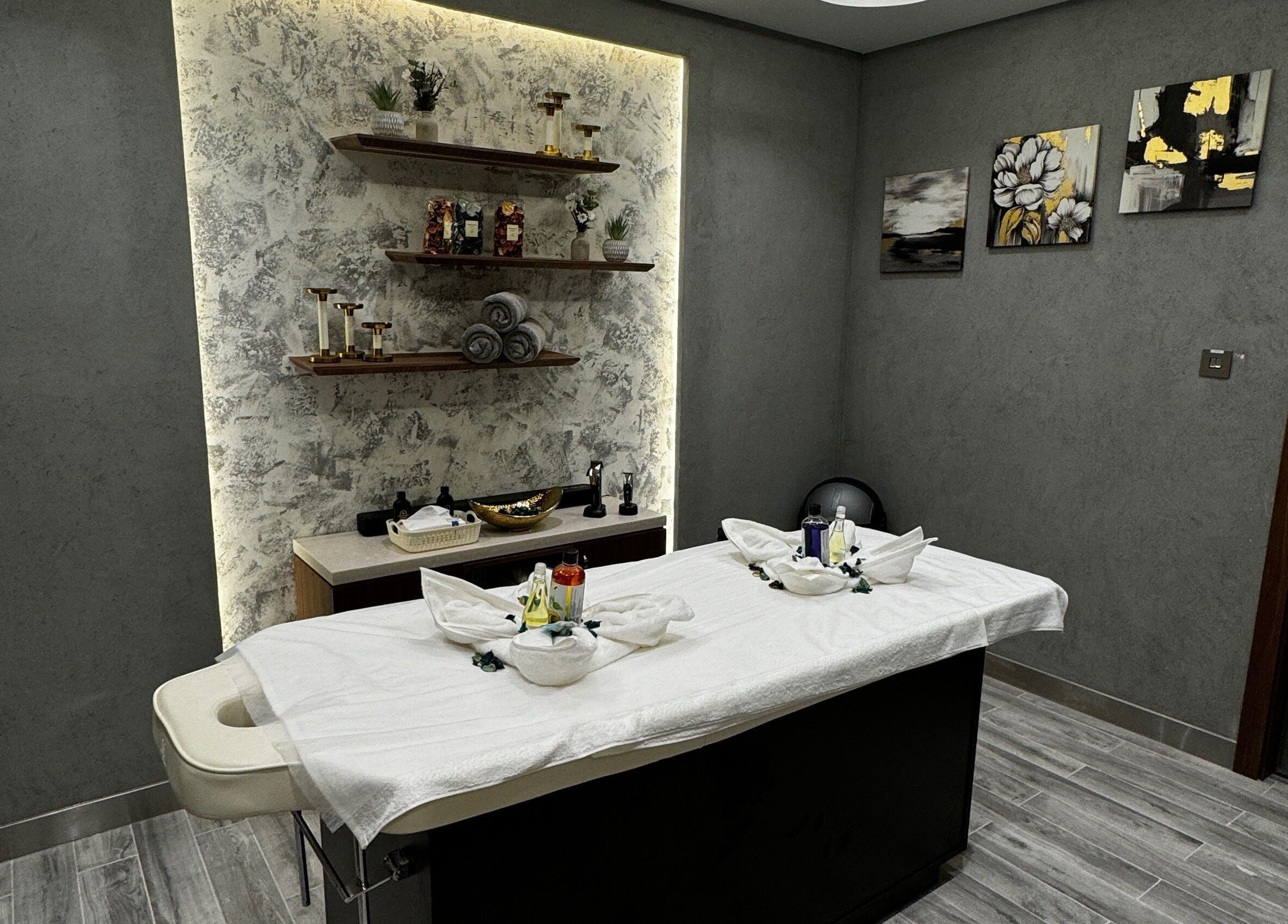 Elegant spa room in Zaks and Sons Salon and Spa, Manama, Capital Governorate, BH, with massage table and decor.