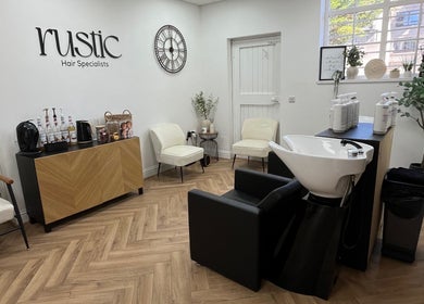 Modern interior of Kate Stephen Hair in Aberdeen, Scotland, GB with elegant seating and styling station.