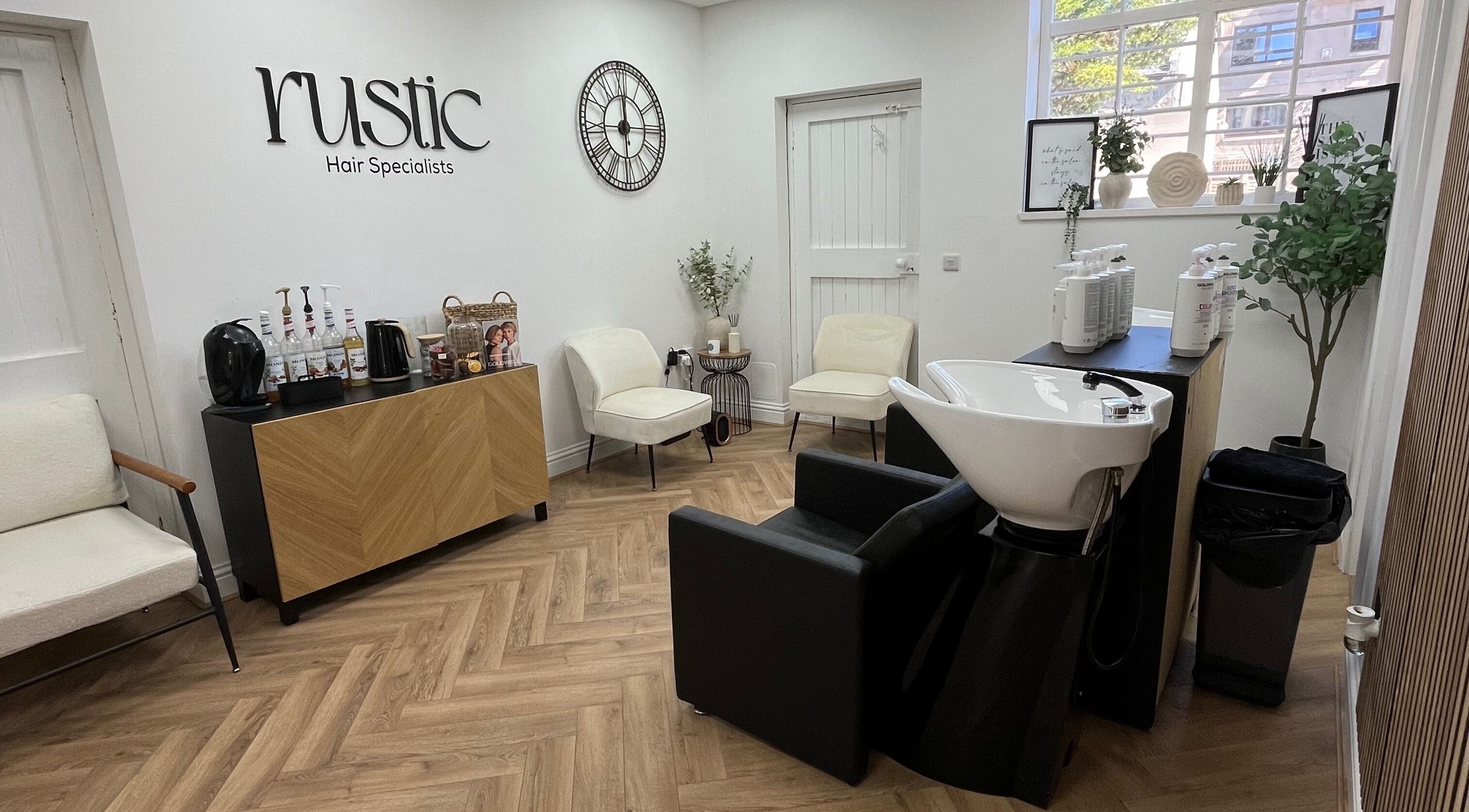 Modern interior of Kate Stephen Hair in Aberdeen, Scotland, GB with elegant seating and styling station.