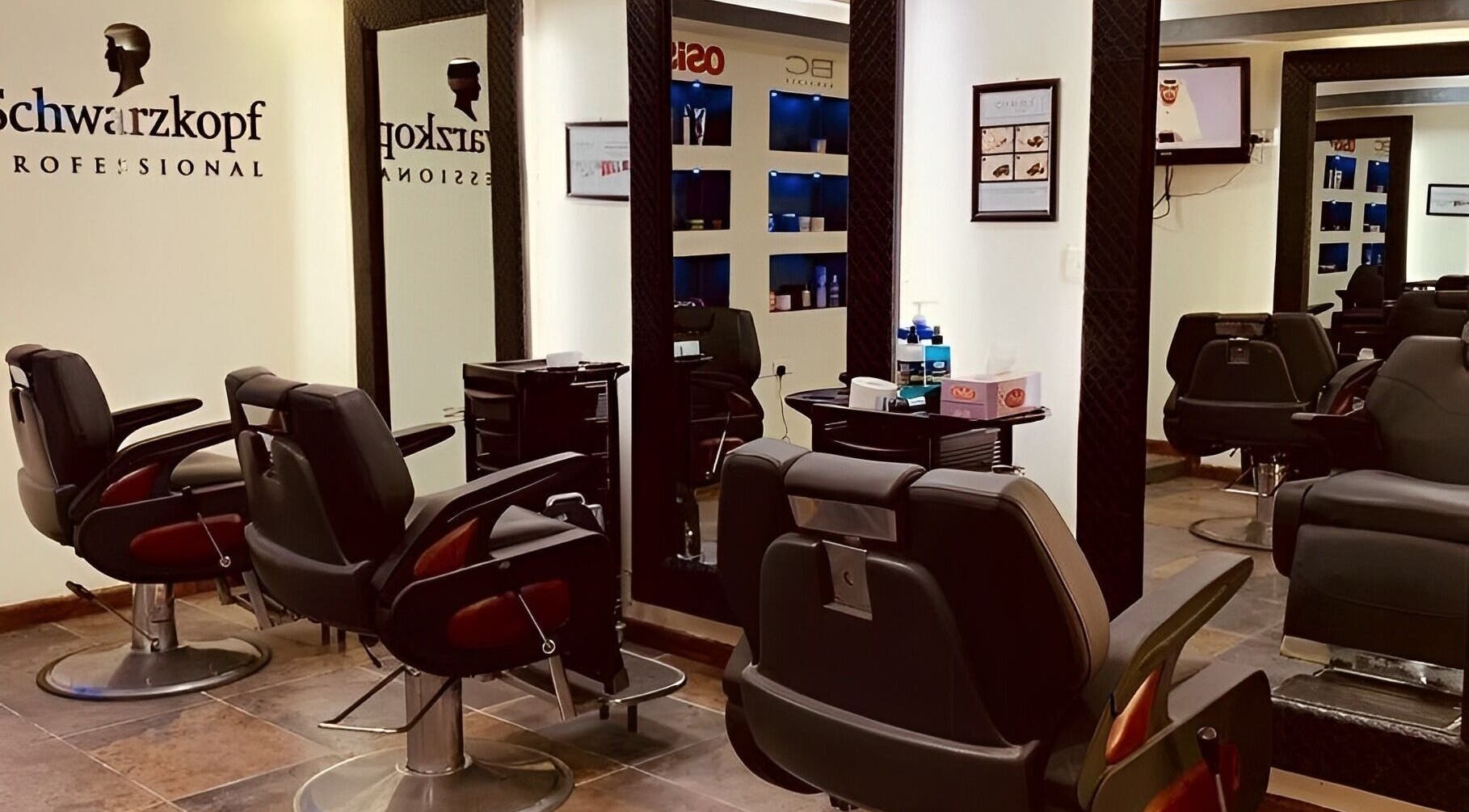 Chic barber chairs in Golden Desert Spa For Men, Abu Dhabi, offering premium grooming services.
