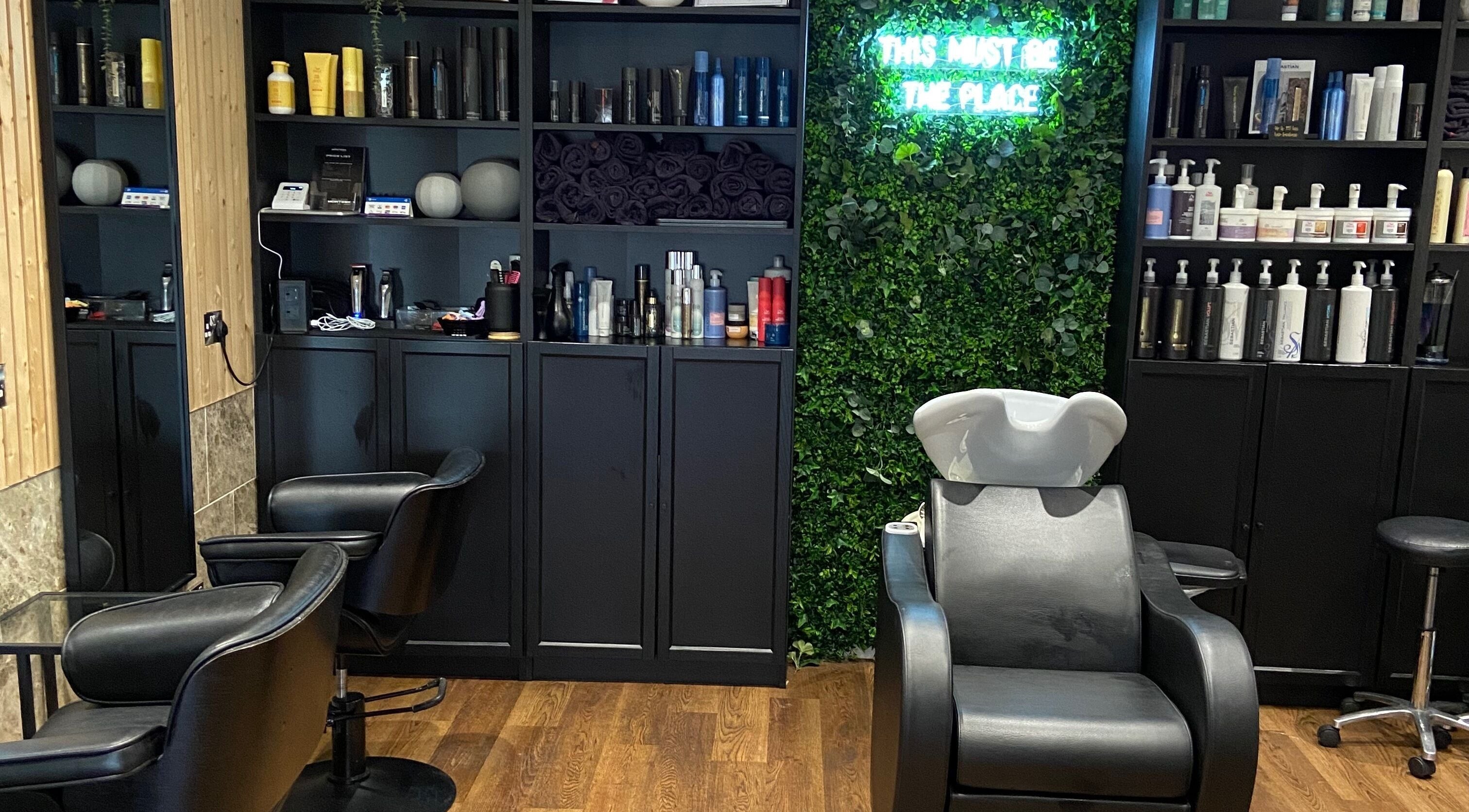 Stylish hair salon interior at Gillian McIntosh Hair, Bathgate, Scotland, GB featuring elegant shampoo station.