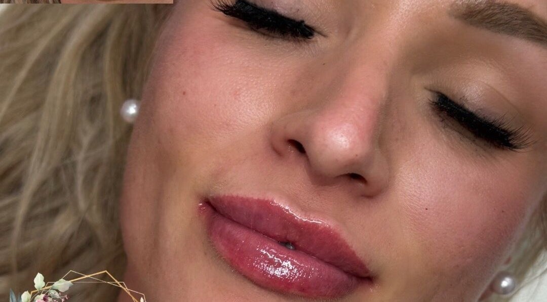 Close-up of a woman with glossy lips and flawless skin at Get Glam Hair & Aesthetics, Oldland Common, England, GB.