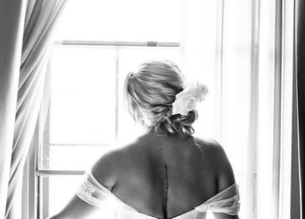 Back view of a bride in elegant attire at Get Glam Hair & Aesthetics, Oldland Common, England, GB.