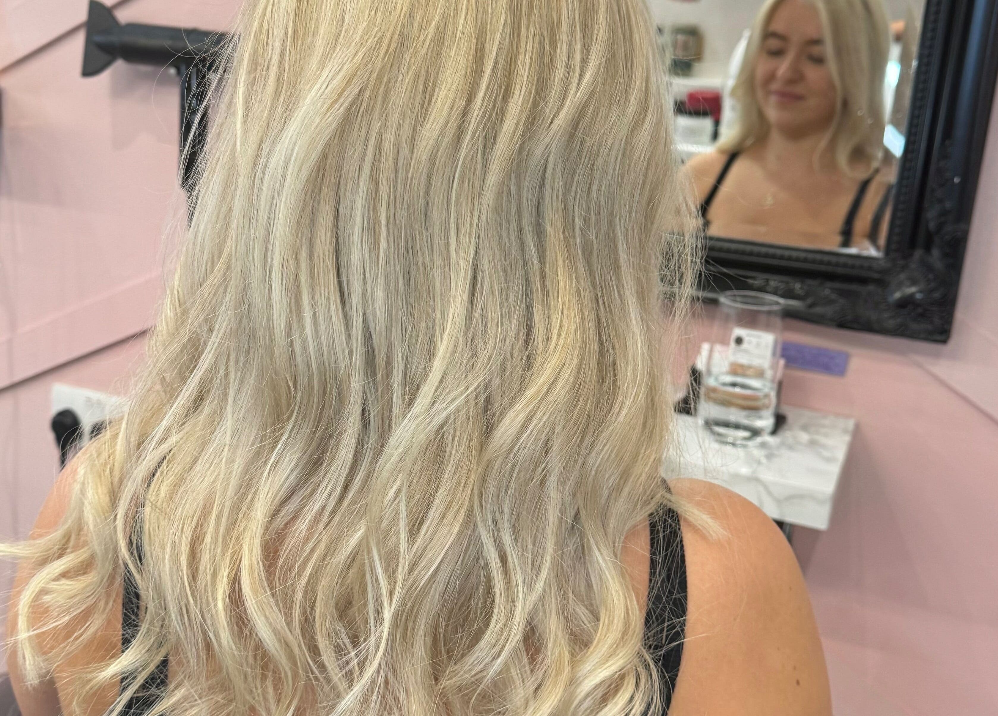 Blonde wavy hairstyle at Get Glam Hair & Aesthetics in Oldland Common, England, GB.