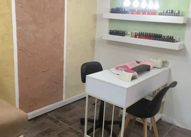 Bright nail studio at Aluna spa, Kfarhim, Mount Lebanon Governorate, LB with manicure station and nail polish colors.