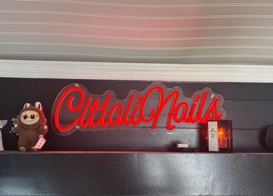 Citlalinails neon sign with decor on shelf in Brick Township, New Jersey, US.