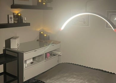 Tranquil spa room at Angelica’s Glow Bar in Maple Ridge, BC. Cozy setting with ambient lighting.