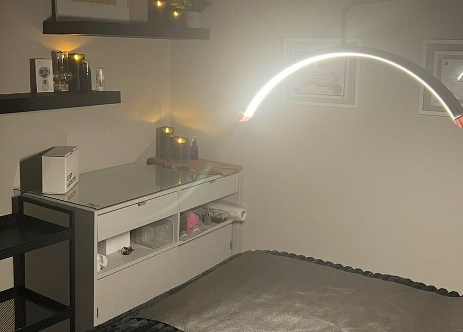 Tranquil spa room at Angelica’s Glow Bar in Maple Ridge, BC. Cozy setting with ambient lighting.