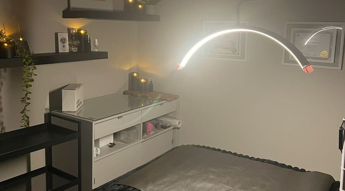 Tranquil spa room at Angelica’s Glow Bar in Maple Ridge, BC. Cozy setting with ambient lighting.