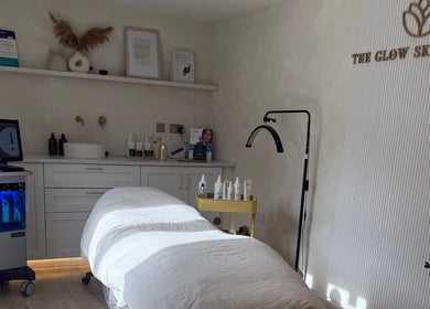 Elegant treatment room at The Glow Skin Clinic in Caddington, Luton, England, GB, showcasing modern wellness equipment.