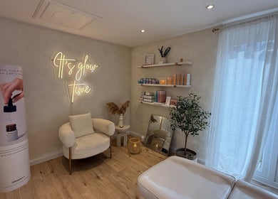 Cozy corner of The Glow Skin Clinic, Caddington Luton, GB, with modern decor and skincare products.