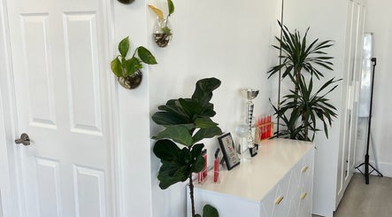 Plants and chic decor in Sandu Beauty & Wellness Hollywood, Florida, US create a serene ambiance.