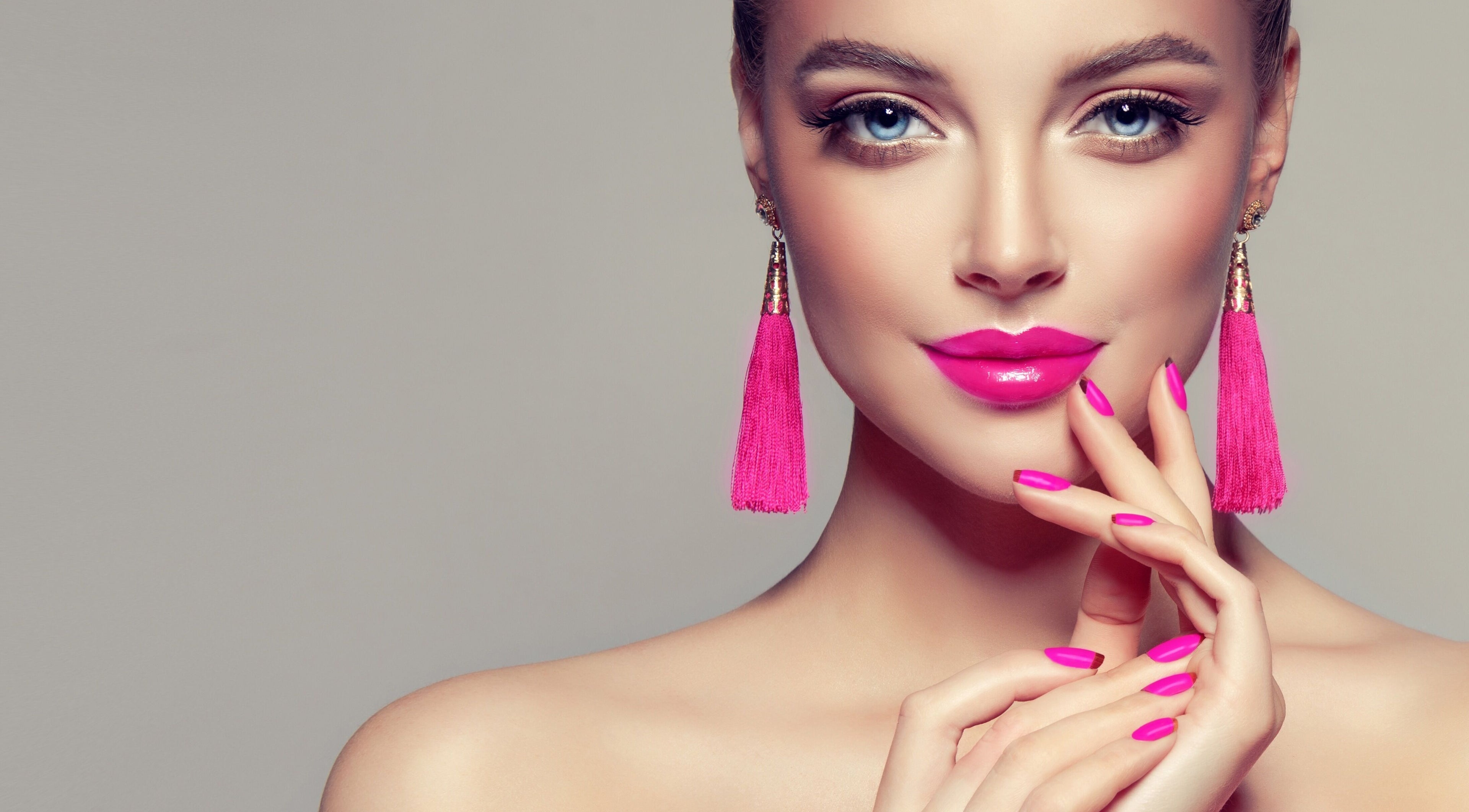 Model shows vibrant pink makeup at Sandu Beauty and Wellness Midtown Miami, Miami, Florida, US.