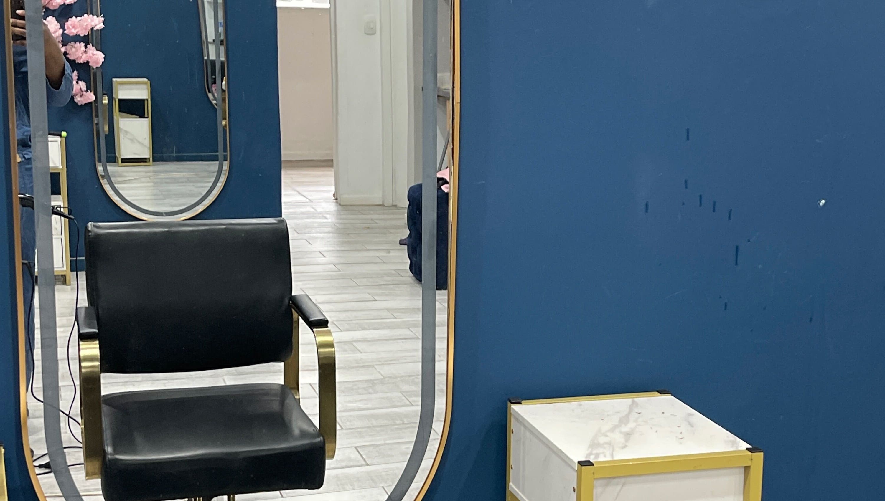 Modern salon chair in front of elegant mirrors at Milees Beauty Studio in Pretoria, Gauteng, ZA.