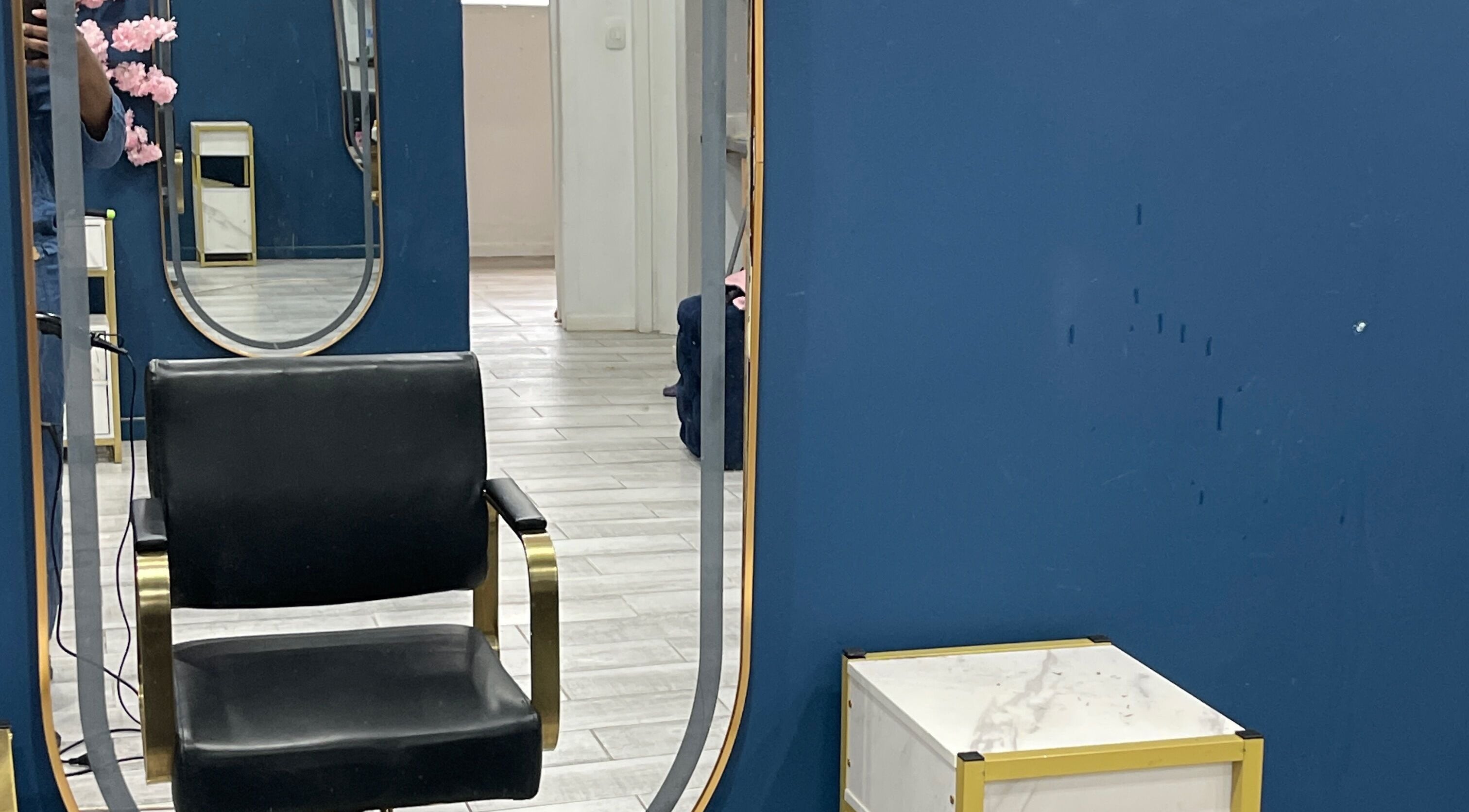 Modern salon chair in front of elegant mirrors at Milees Beauty Studio in Pretoria, Gauteng, ZA.