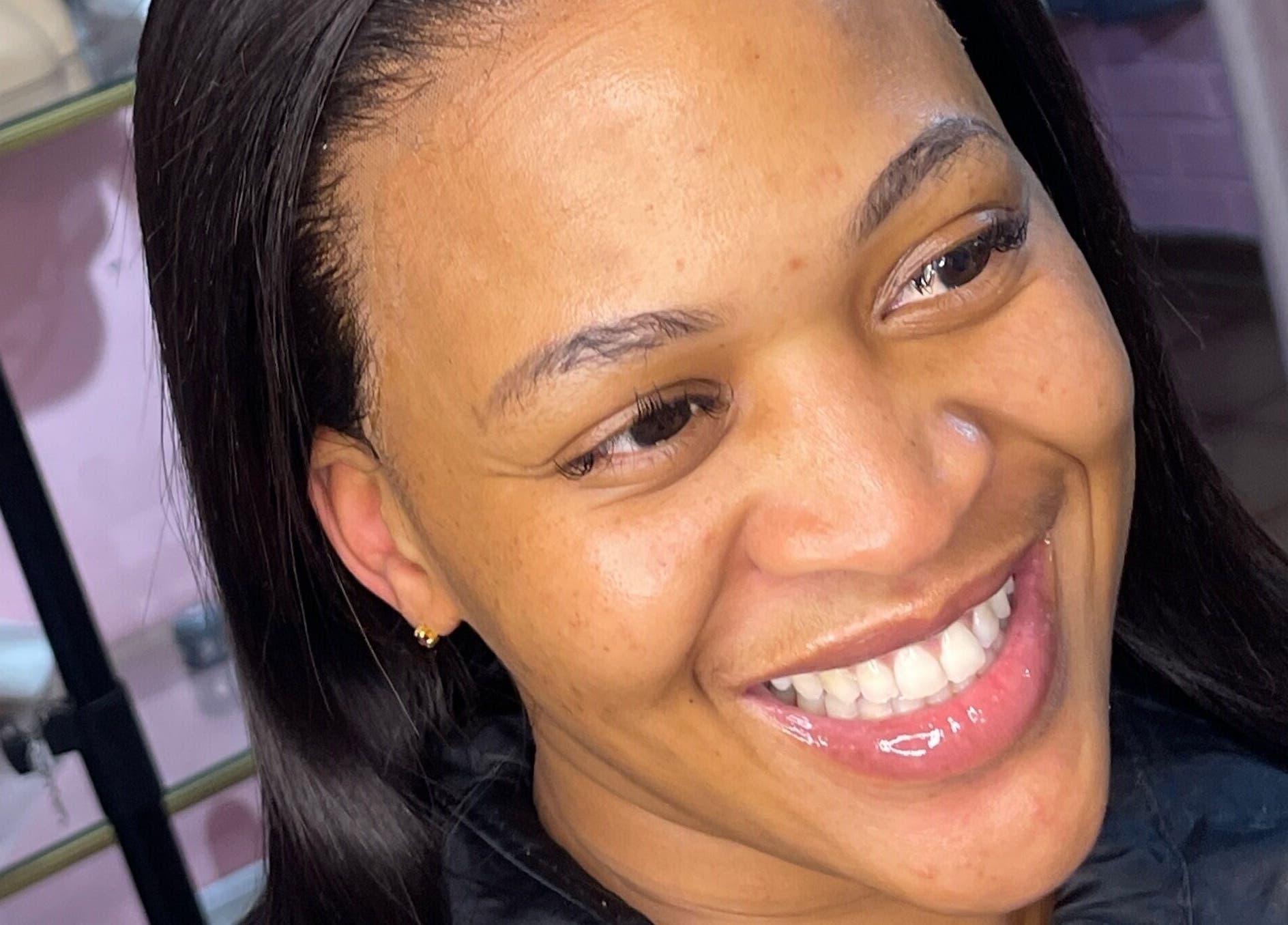 Client with radiant skin and smile at Milees Beauty Studio, Pretoria, Gauteng, ZA.