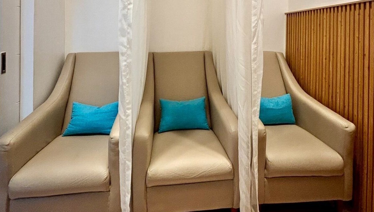 Elegant seating area at Skin Desyre Aesthetic Clinic - Cainta, Cainta, Calabarzon, PH with neutral armchairs.