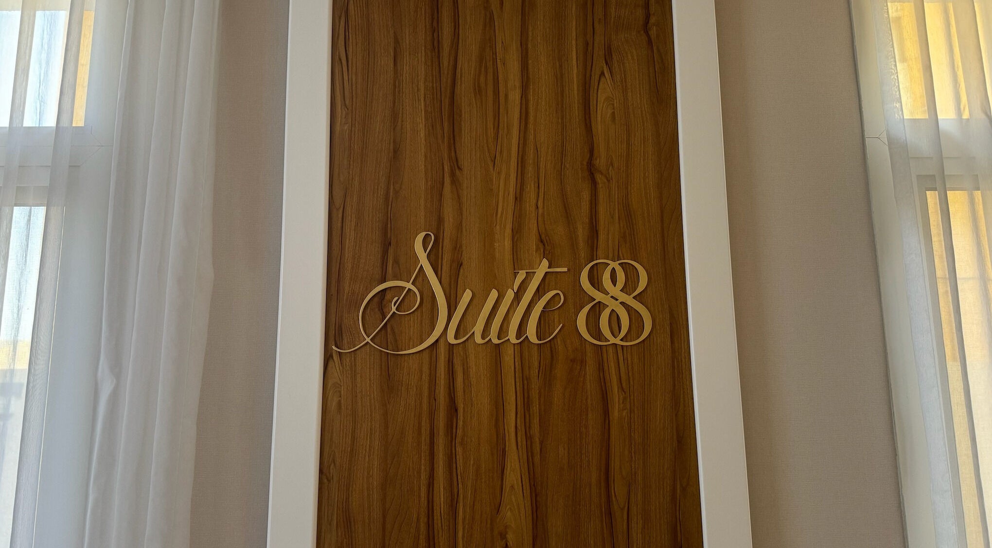 Suite 88 Beauty Lounge sign on a wooden wall in Sharjah, Sharjah, AE.