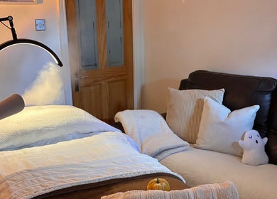Tranquil therapy room at Home Therapy, Kidderminster, England, GB with massage bed and soothing atmosphere.