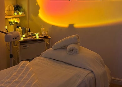 Serene therapy room at Home Therapy, Kidderminster, England, GB with soft lighting and massage table.