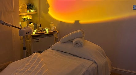 Serene therapy room at Home Therapy, Kidderminster, England, GB with soft lighting and massage table.