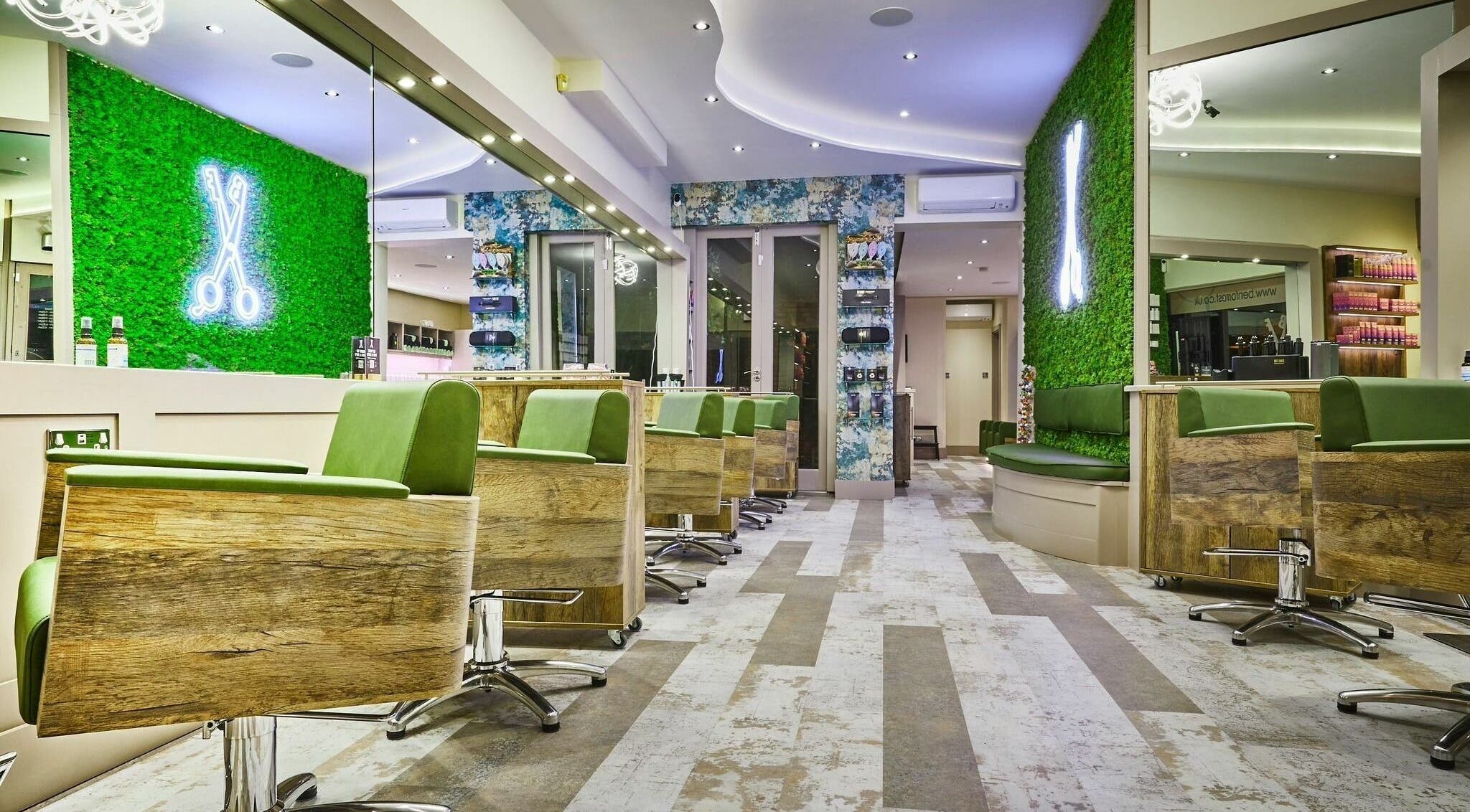 Elegant interior of Ben Forrest Hair Salon Kew in Richmond, England, GB with vibrant green decor and stylish chairs.