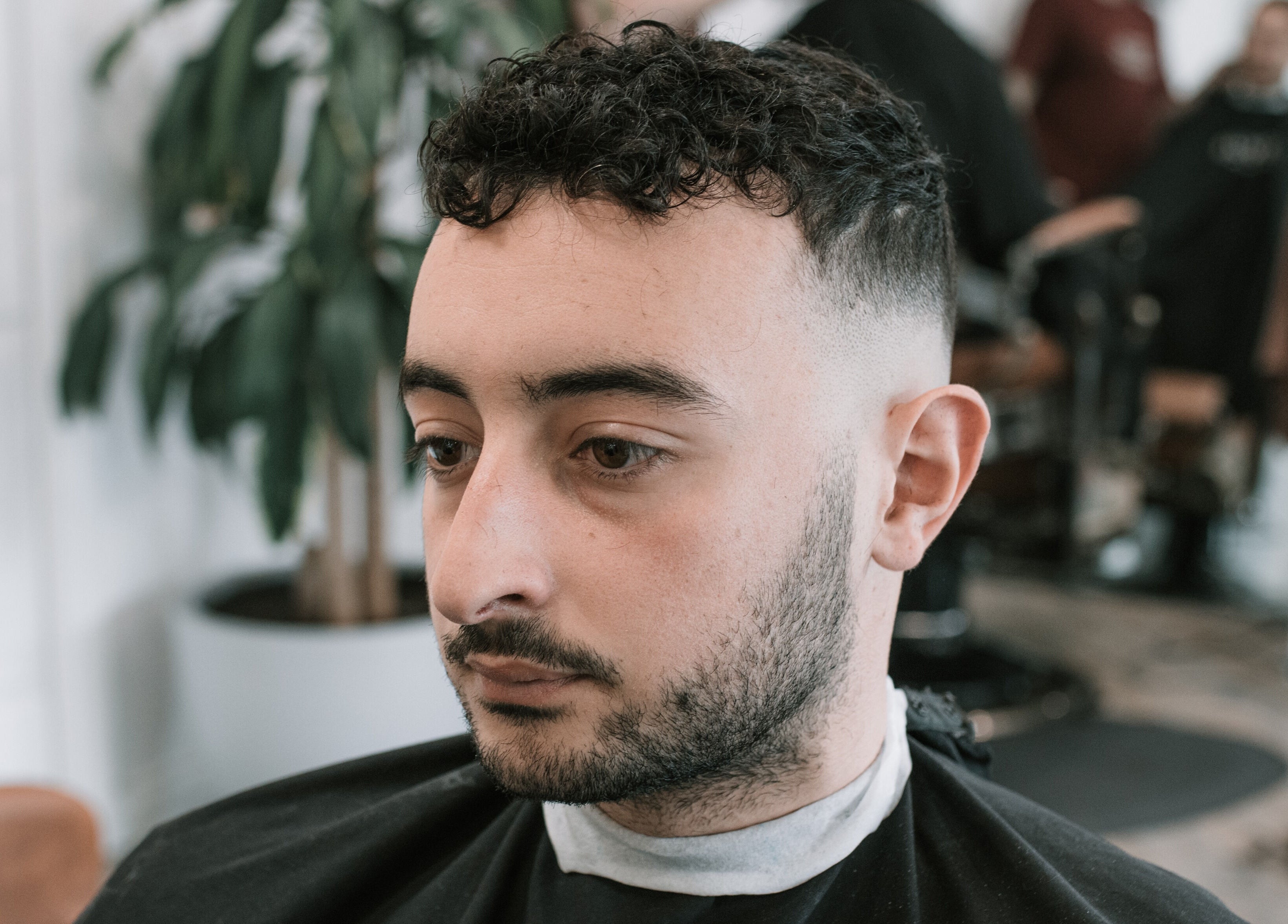 Close-up of a man with a fresh fade haircut at Blck and Brwn Barber Shop, Melbourne, Victoria, AU.