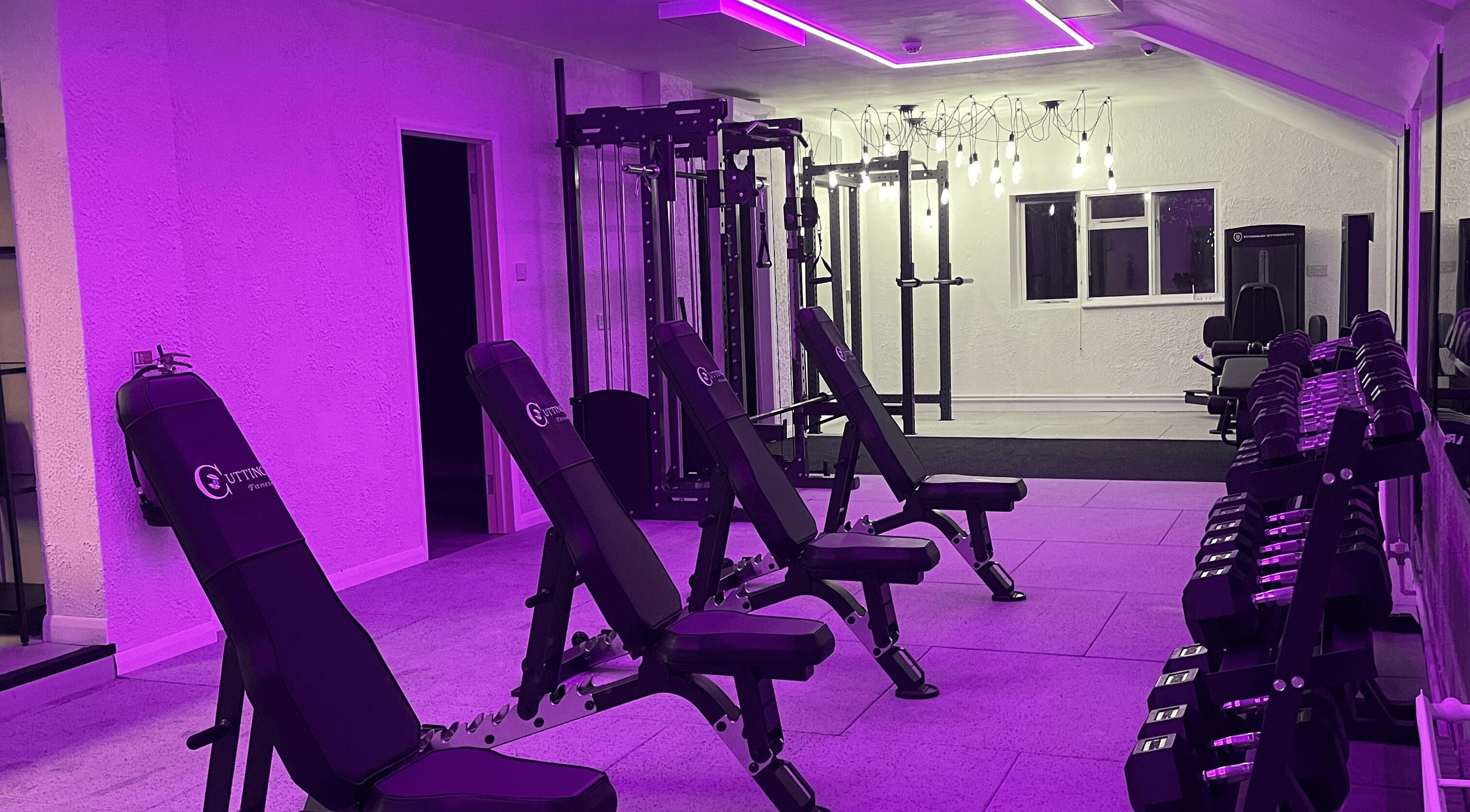 Modern gym at Cutting Fitness - Turners Hill with sleek equipment and vibrant lighting in Turners Hill, England, GB.