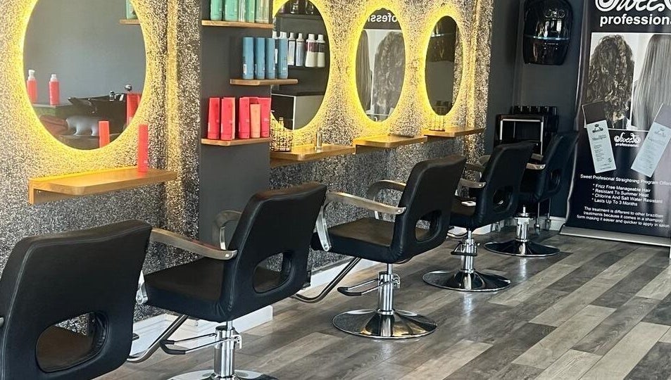 Elegant salon layout at La Bella's Hair and Beauty Salon, Cape Town, Western Cape, ZA, featuring modern styling chairs.