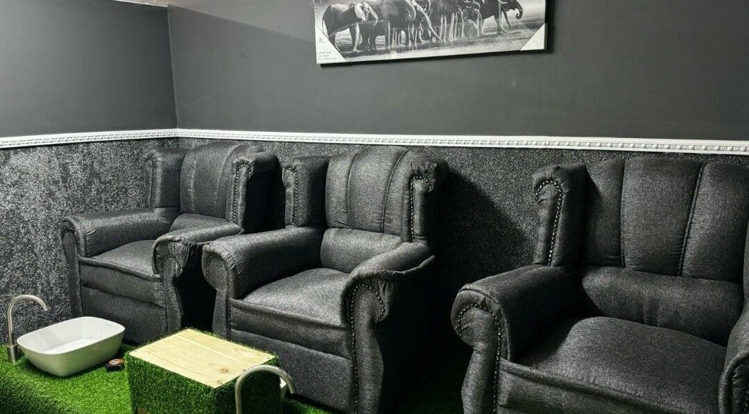Cozy chairs at La Bella's Hair and Beauty Salon in Cape Town, Western Cape, ZA, offering a serene relaxation area.