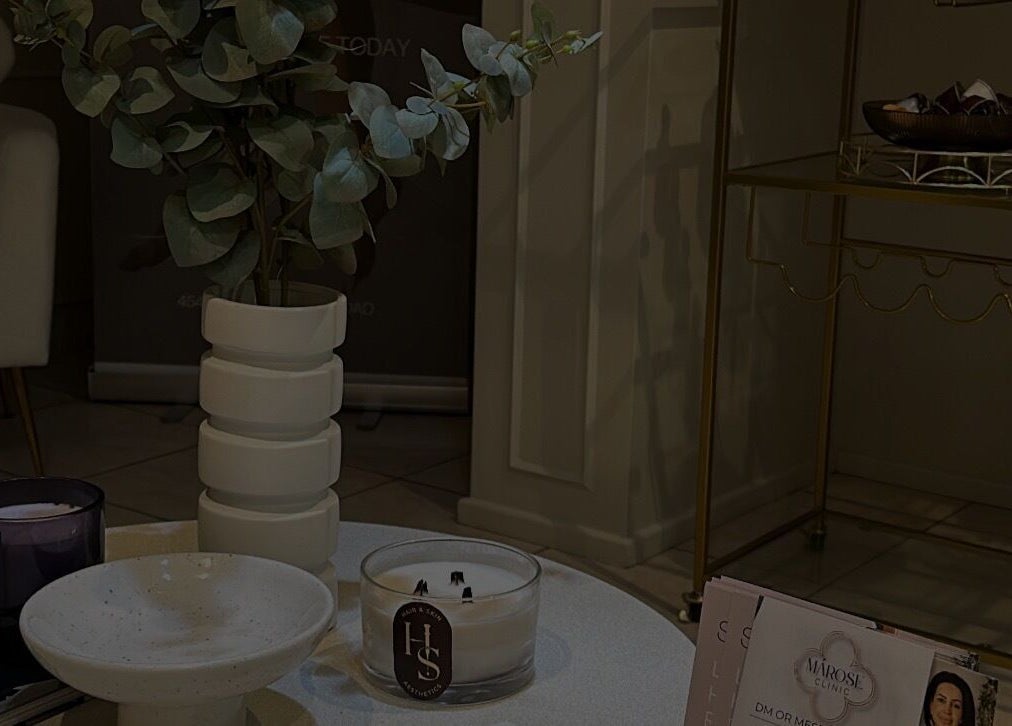 Cozy seating at Got2BeLashedx, Bradford, England, GB, featuring stylish decor and inviting candles.