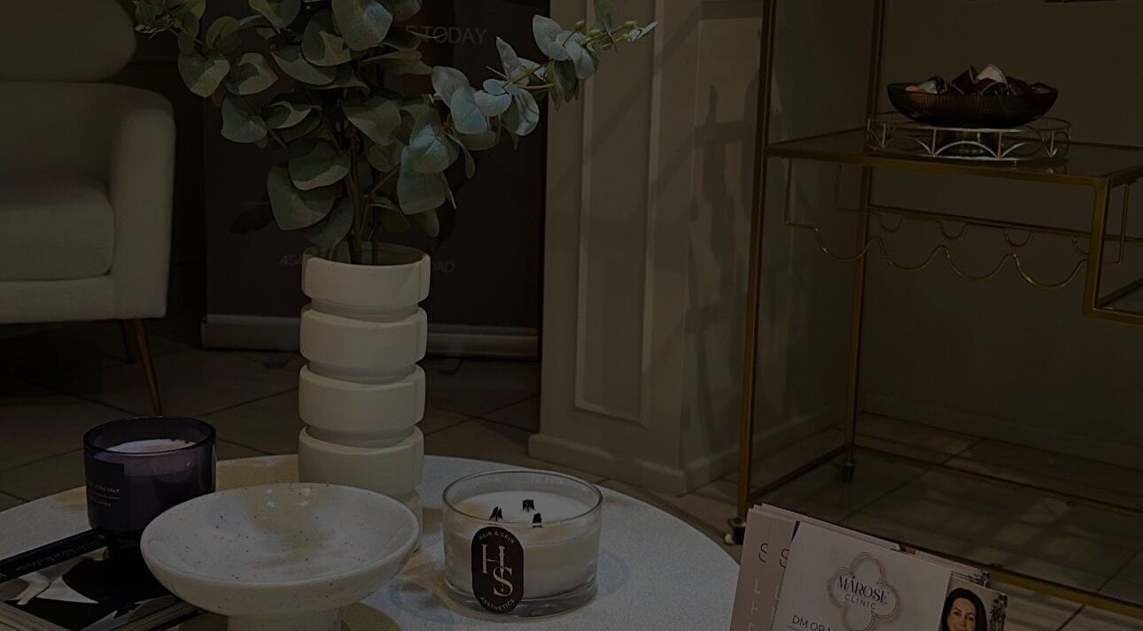 Cozy seating at Got2BeLashedx, Bradford, England, GB, featuring stylish decor and inviting candles.