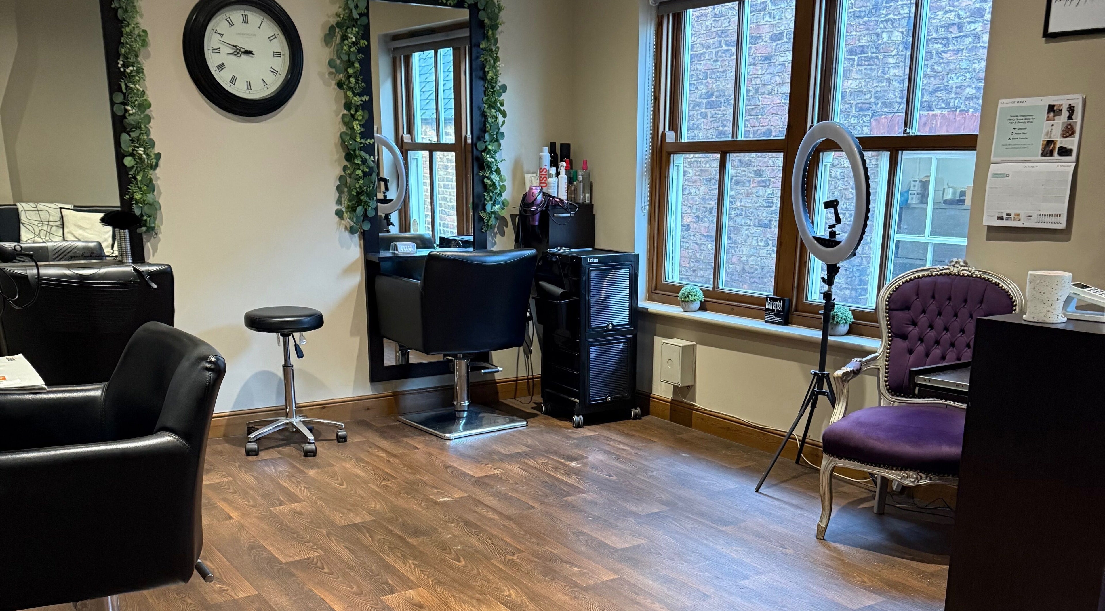 Cozy interior of Hair By Sara in Thirsk, England, GB with stylish seating and grooming area.