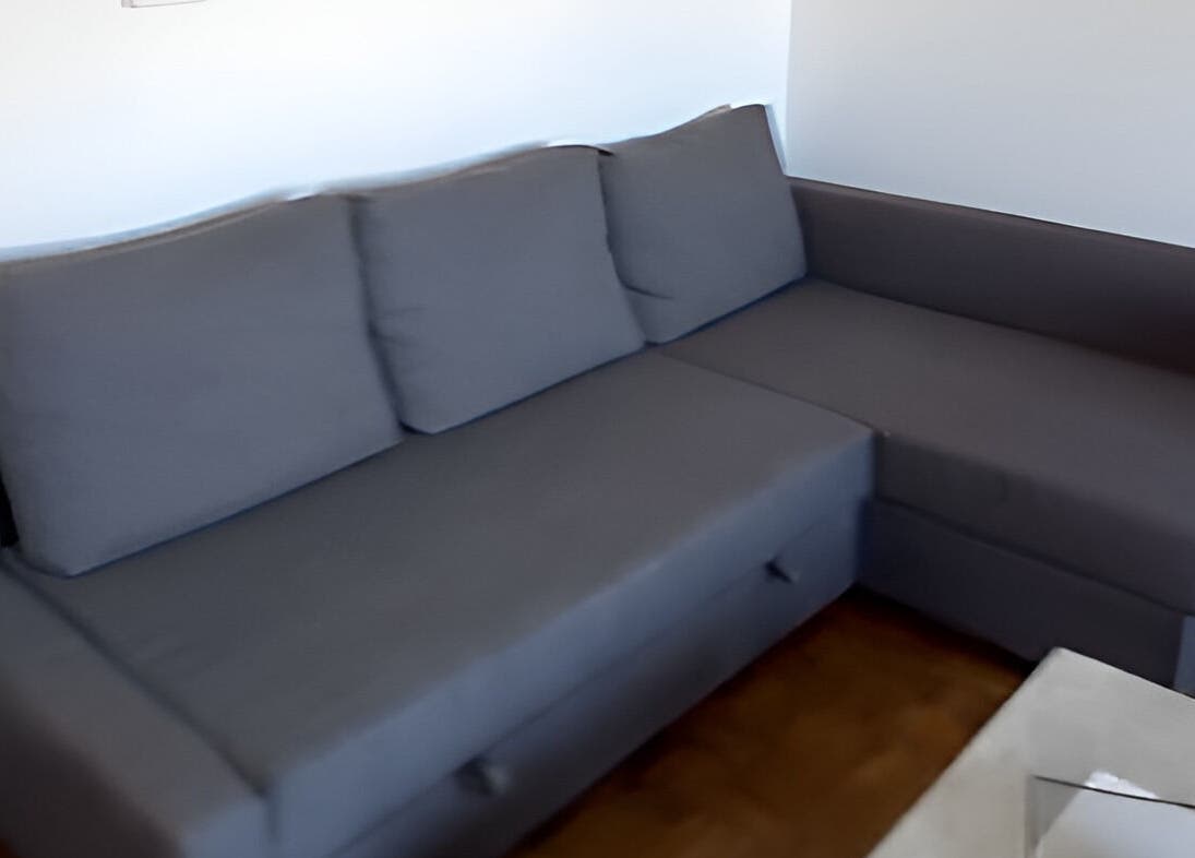 Modern gray sofa at LadyLuxe Salon, Linz, Oberösterreich, AT. Perfect for relaxation and comfort.