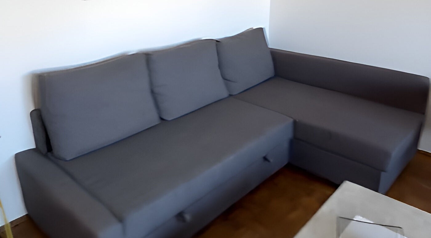 Modern gray sofa at LadyLuxe Salon, Linz, Oberösterreich, AT. Perfect for relaxation and comfort.