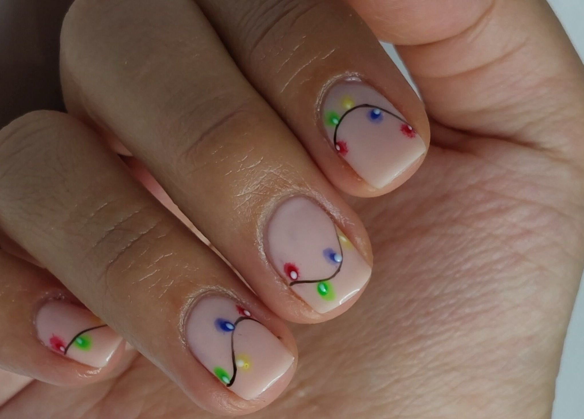 Vibrant nail design at LadyLuxe Salon in Linz, Oberösterreich, AT showcasing colorful dotted patterns.