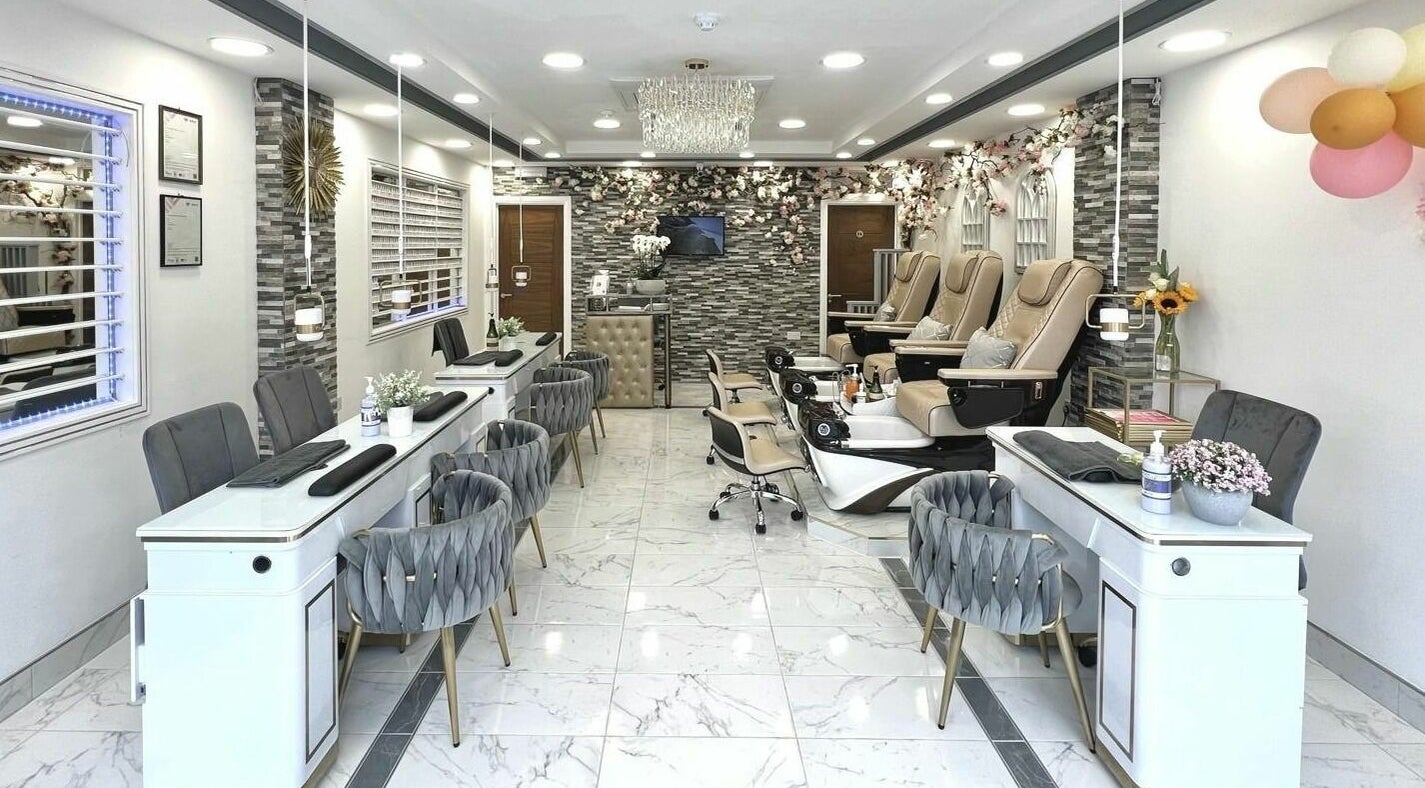 Elegant interior of Venus Nails in London, England, GB, showcasing modern nail salon design and luxury pedicure chairs.