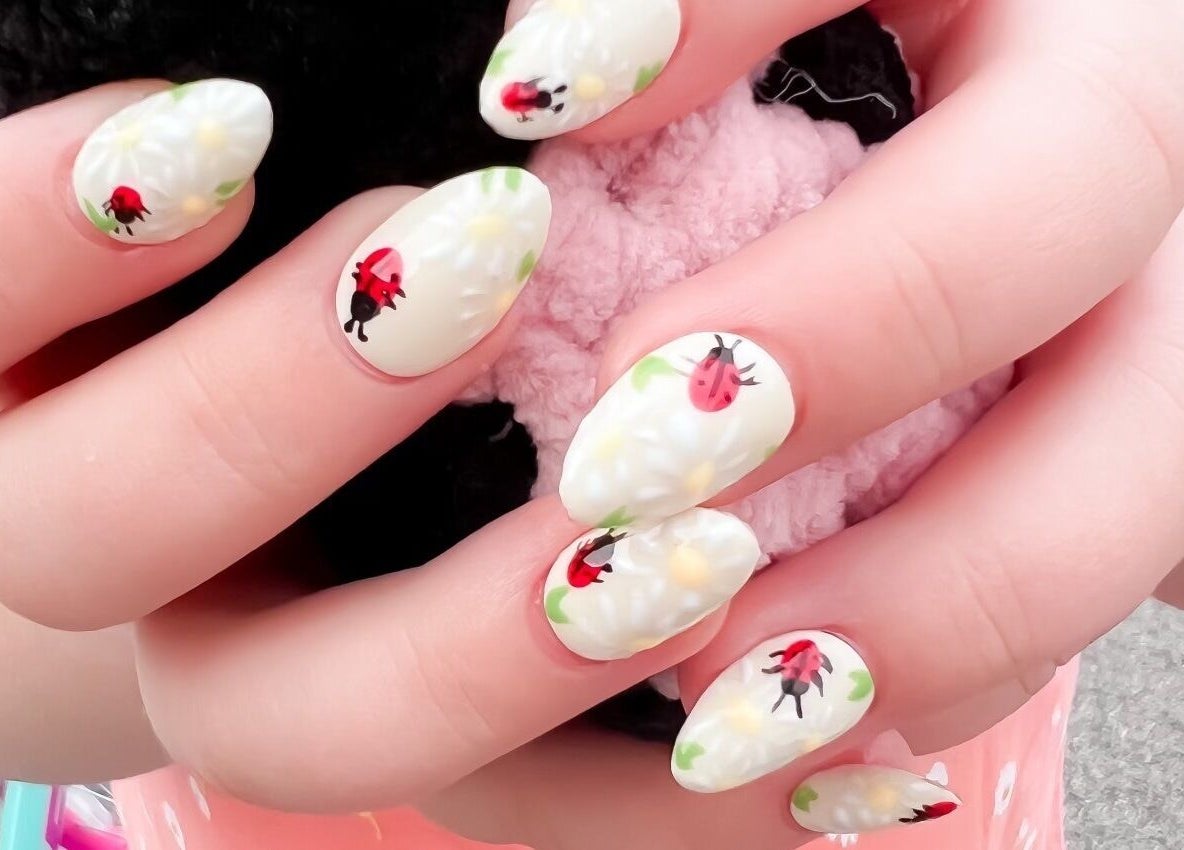 Detailed ladybug nail art at Rook and Raven Nail Co., Saltsburg, Pennsylvania, US.