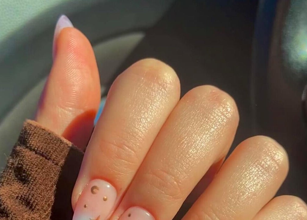 Stylish nail art at Rook and Raven Nail Co., Saltsburg, Pennsylvania, US, featuring celestial designs.