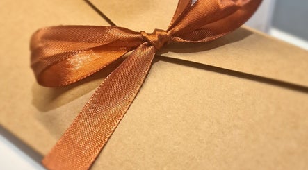 Elegant gift box with copper ribbon at J'adore Beauty Rooms, Normanton, England, GB.