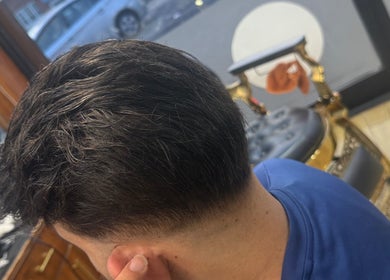 Styled men's haircut at HairSystem Studio, Walton-on-Thames, England, GB. Modern salon interior.