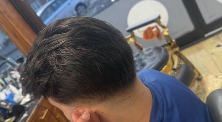 Styled men's haircut at HairSystem Studio, Walton-on-Thames, England, GB. Modern salon interior.