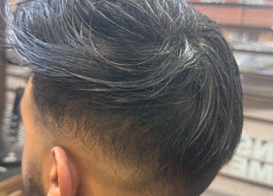 Close-up of trendy men's haircut at HairSystem Studio, Walton-on-Thames, England, GB.