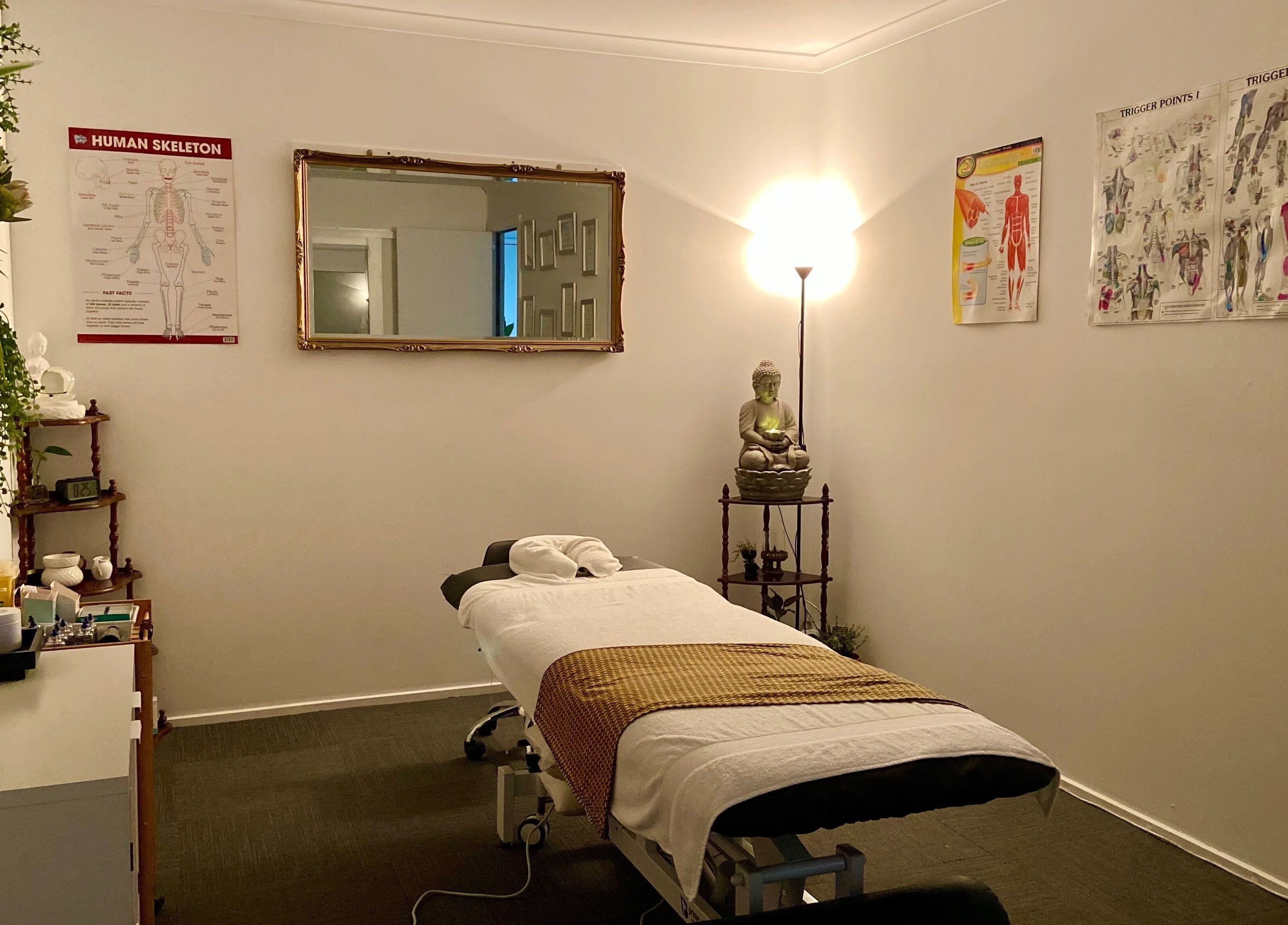 Relaxing massage room at Muscle Relief, Narre Warren South, Victoria, AU with calming decor and warm lighting.