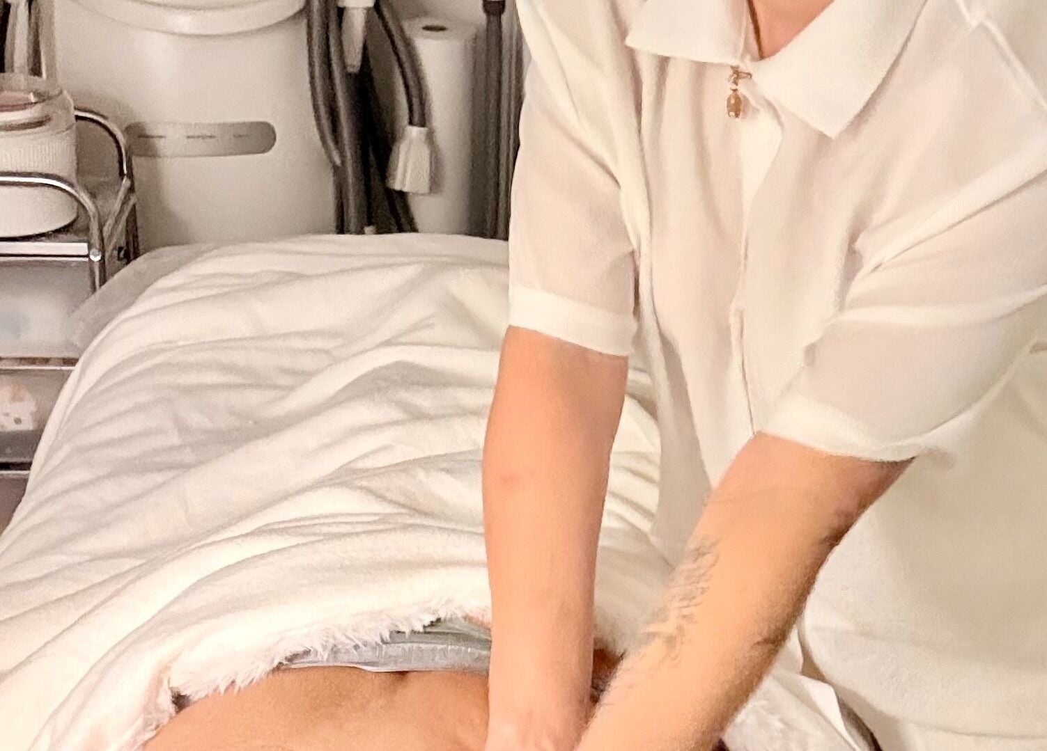 Therapist provides relaxing massage at Gbeauty, Surry Hills, New South Wales, AU, enhancing wellness experience.