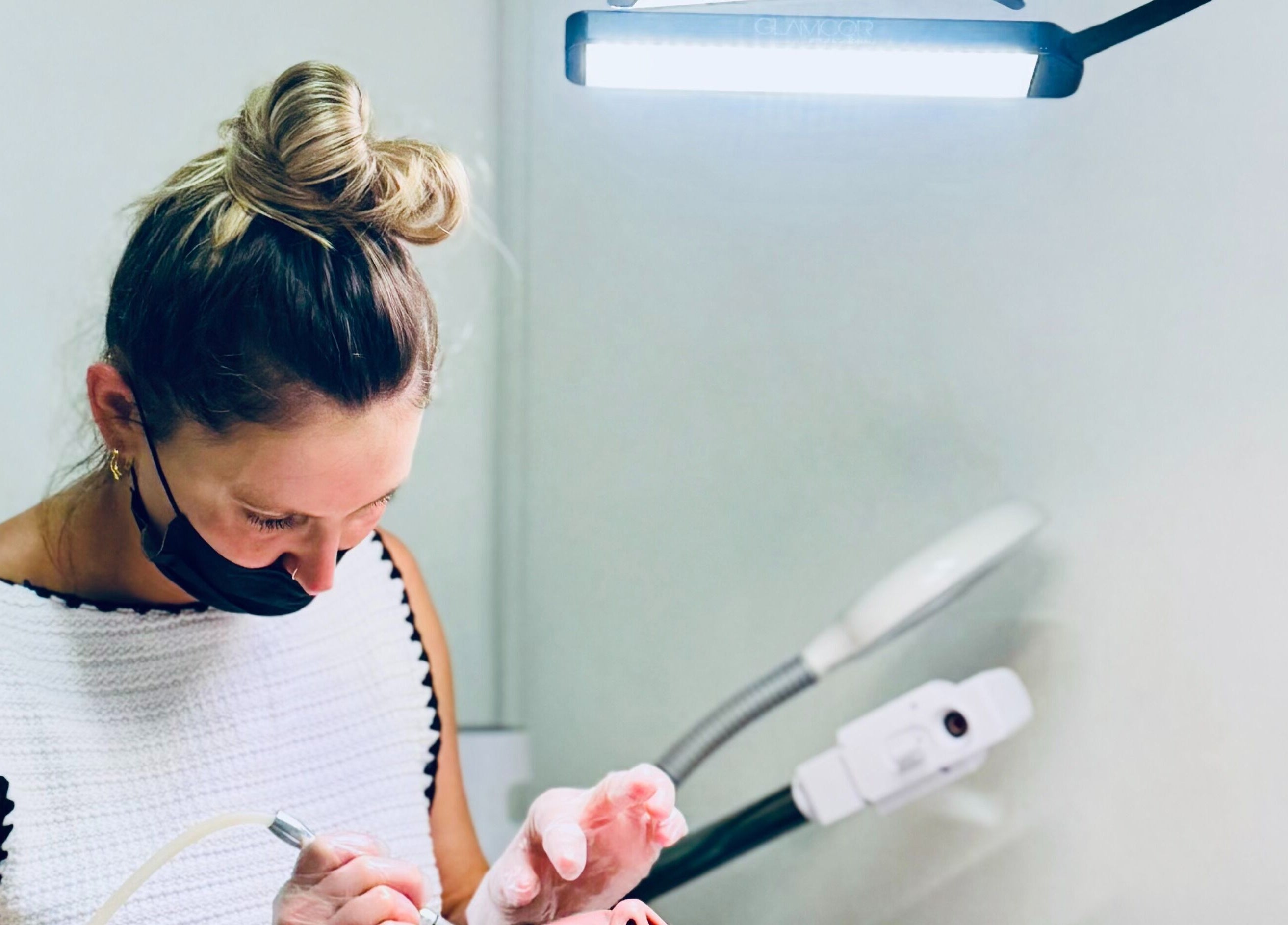 Professional providing beauty treatment at Gbeauty, Surry Hills, New South Wales, AU.